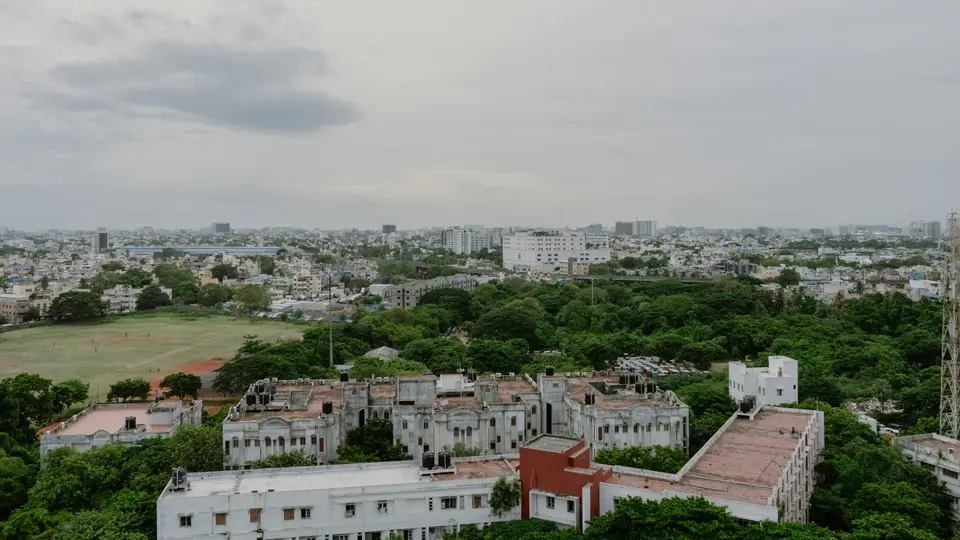 Chennai from the air, low rooftops running out to the horizon.
